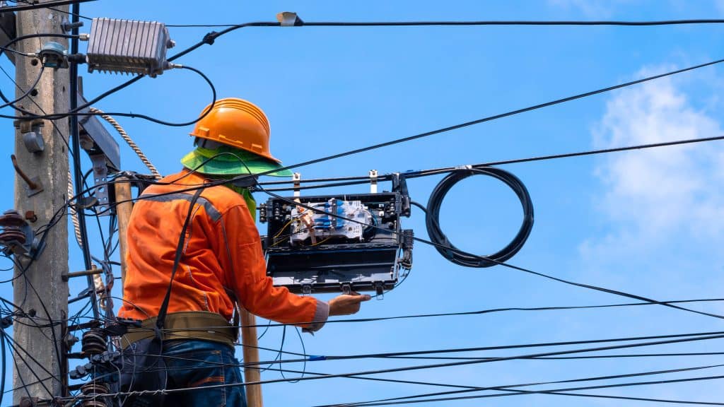 Worker splicing fiber optics for Metro Optics LLC located in New Jersey